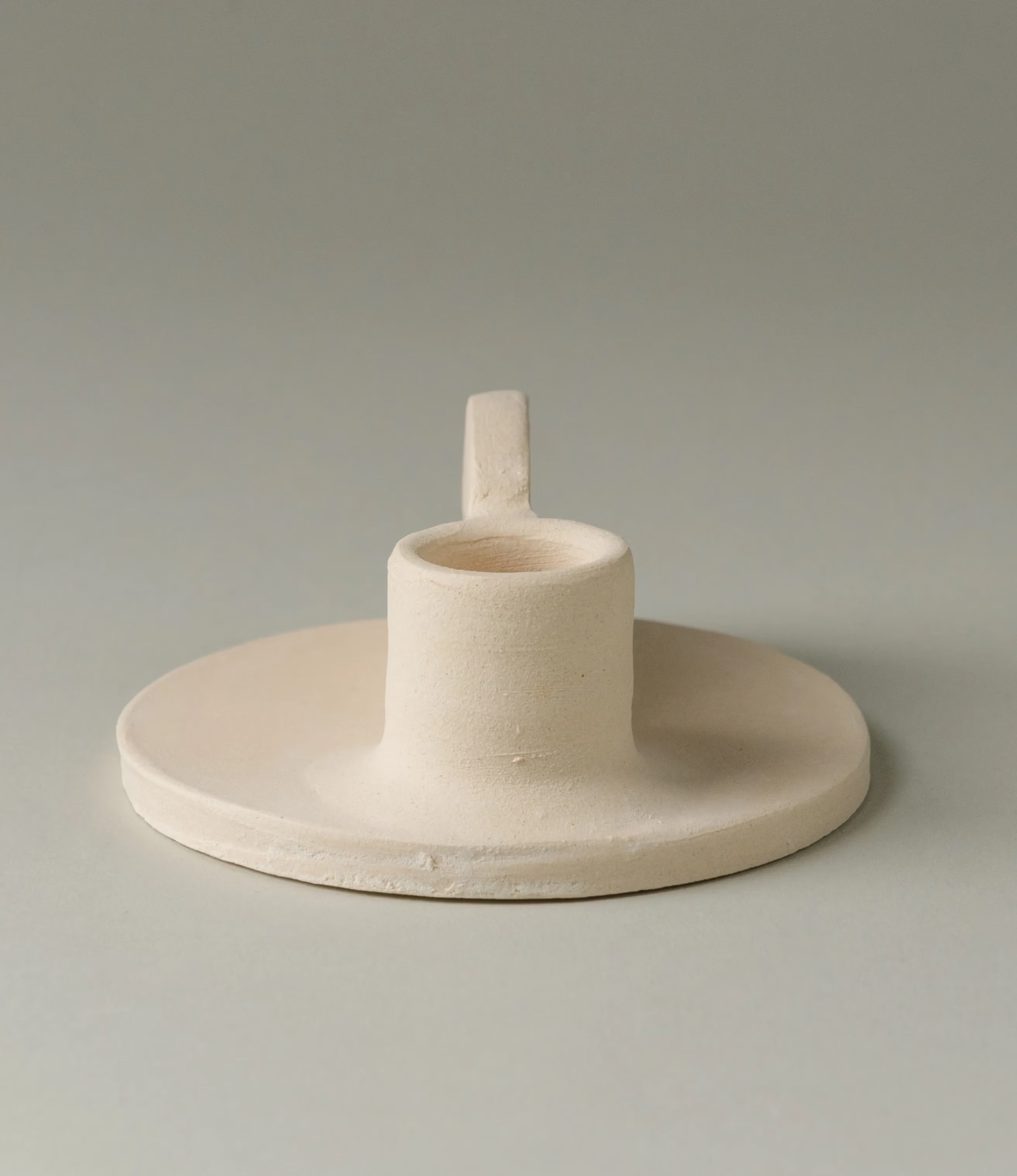 Myrtha Candle Holder is created by Alfareria La Nava. The product comes in a cream color and it has a natural matte finishing.