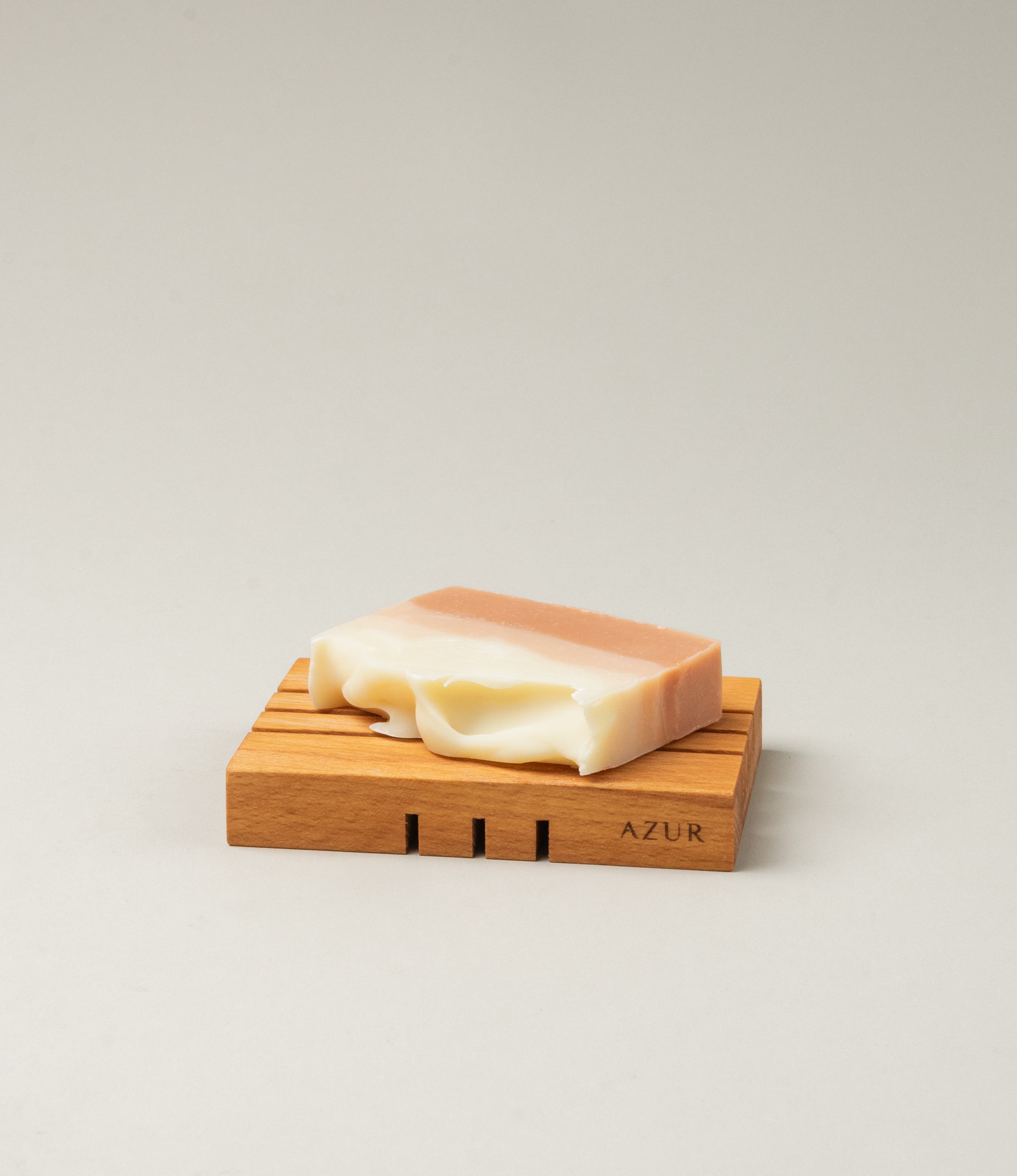 Wooden Soap tray from Azur Natural Bodycare. The item evokes the japanese minimalism with its simple yet sophisticated shape. The Tray has three split on it on both sides, but on the different direction.