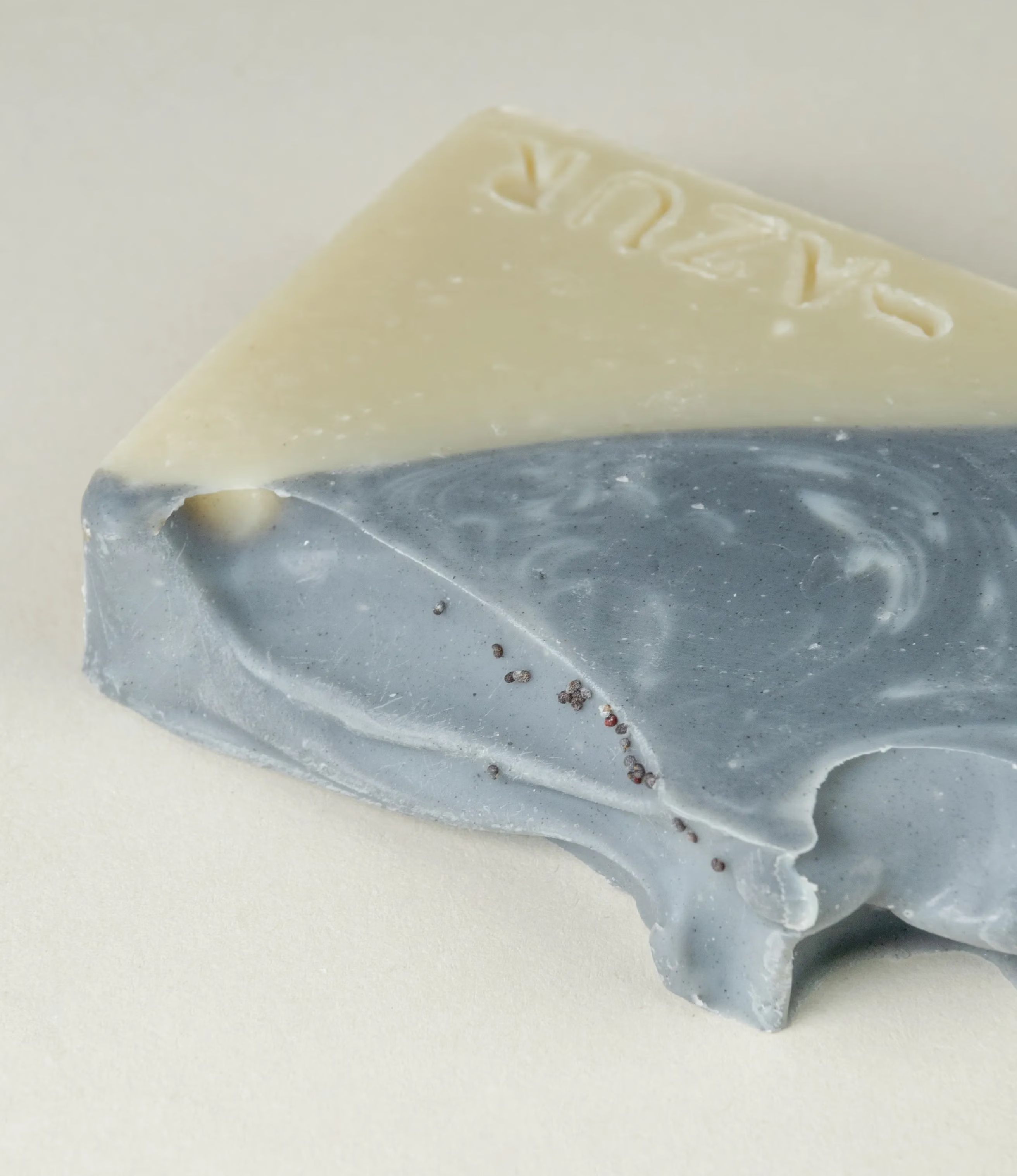 This soap has the scent of Wild Woods and it was crafted by Azur Natural Bodycare. The product merges two colors, light olive and dark grey. The top of the soap looks like the waves of the ocean.