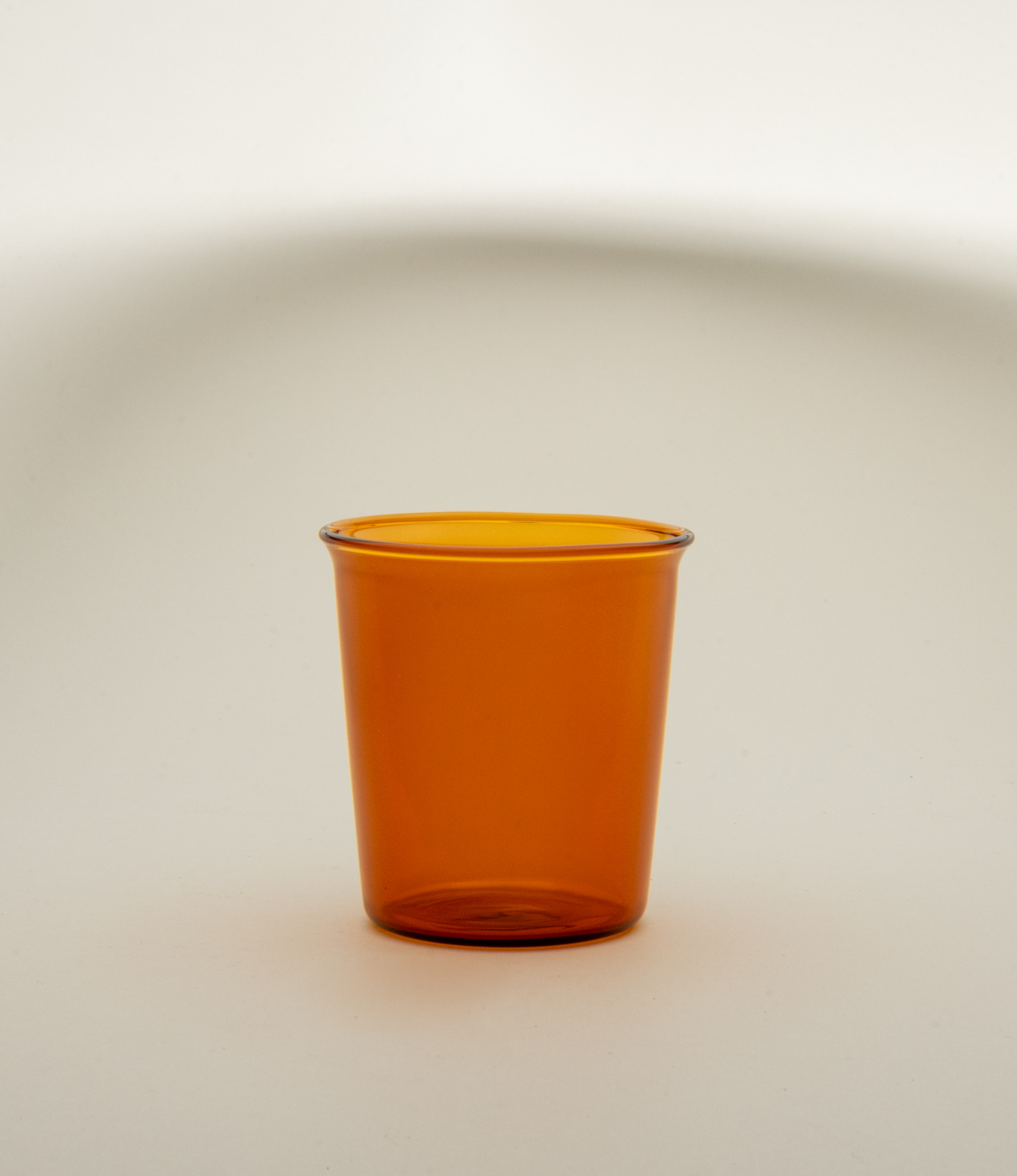 Cast Amber Glass from Kinto. The tip of the glass turns slightly outwards which makes drinking even more comfortable.