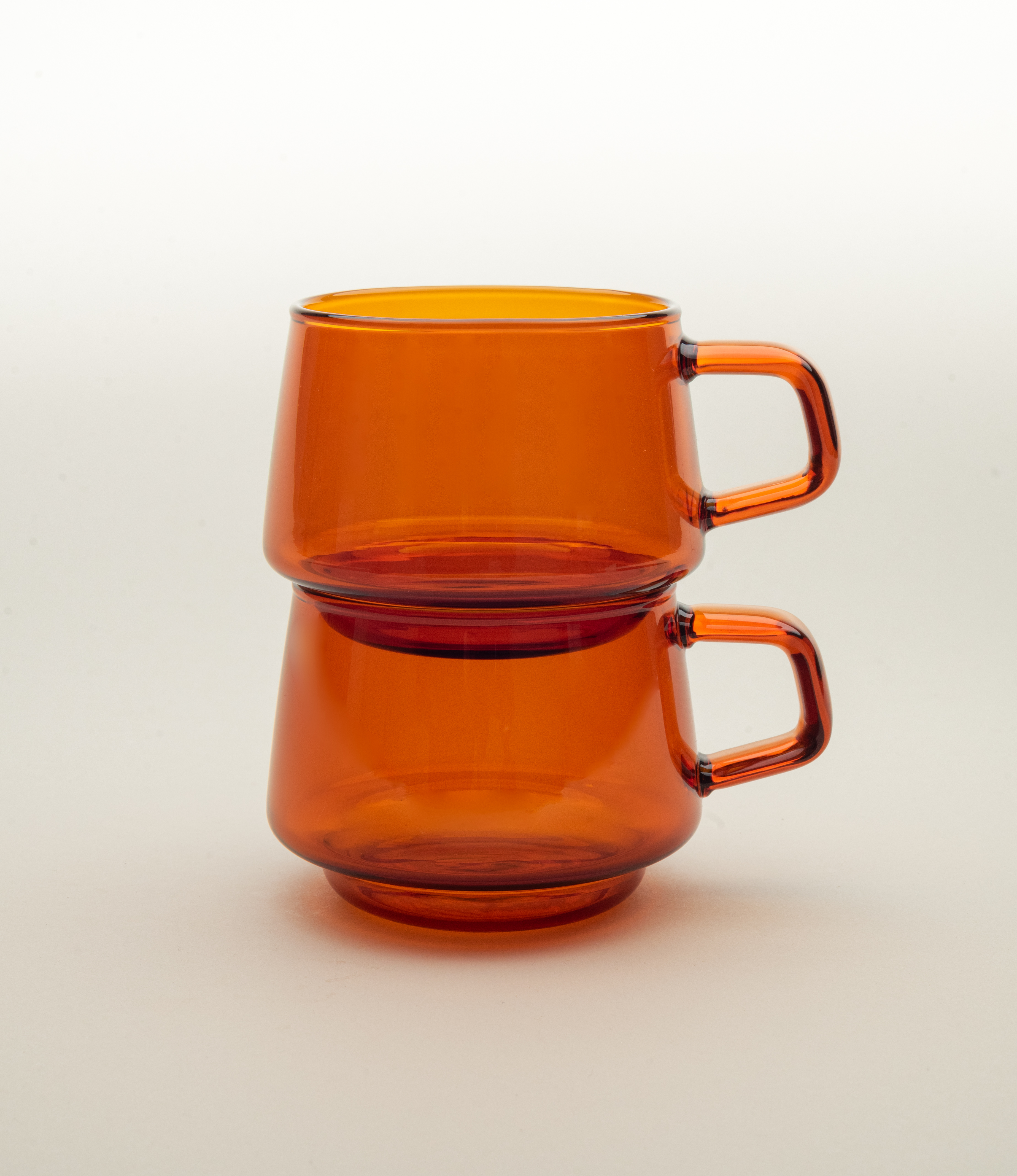 Sepia Cup is a glass mug from the japanese brand Kinto. The item is coming in the popular amber color which fits well the nostalgic shape of the product. The product can hold 270ml of liquid.