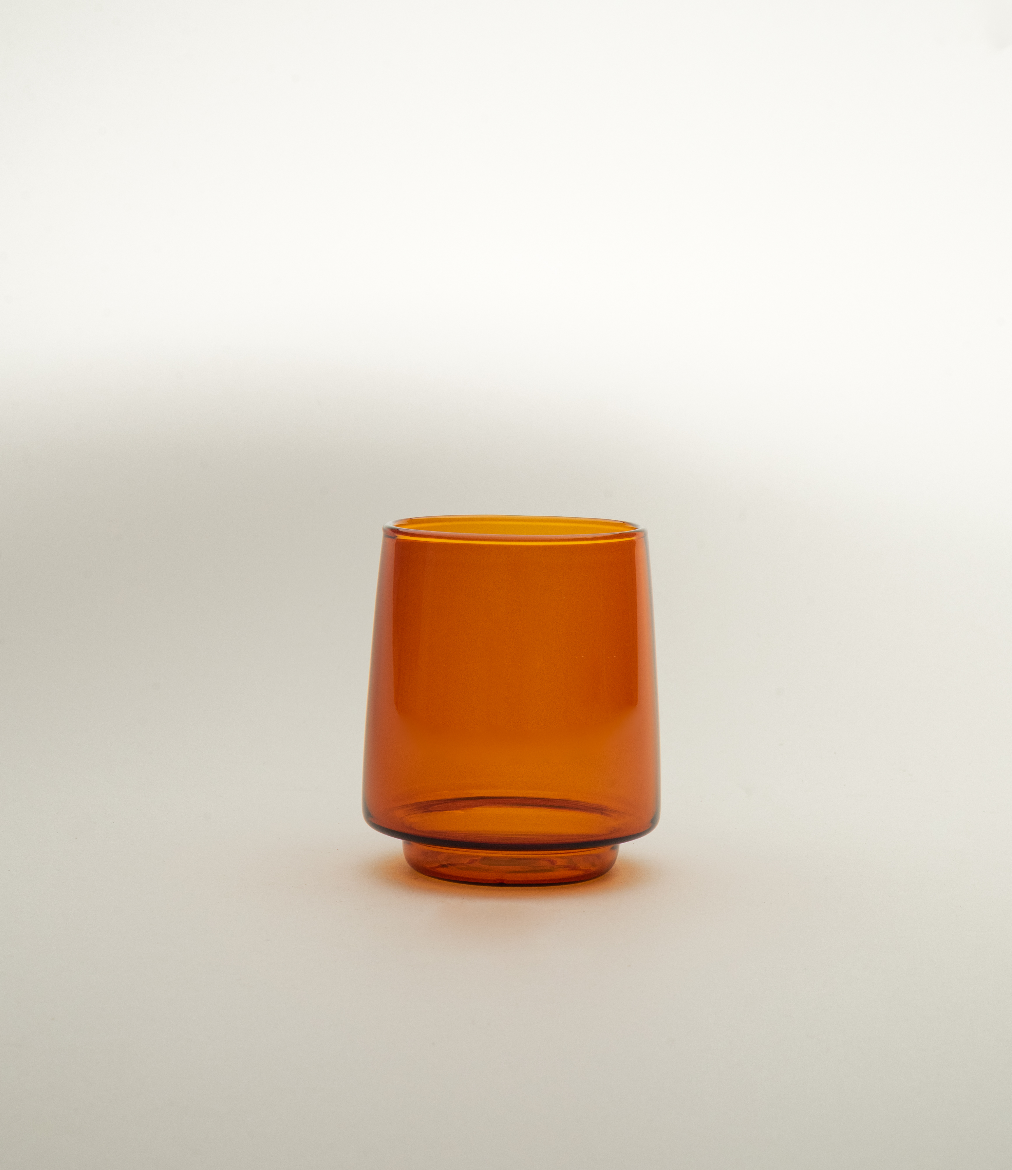 Sepia Tumbler is a glass item from the japanese brand Kinto. The product was made to hold your favorite beverages up to 370 ml. The item has the nostalgic amber color.
