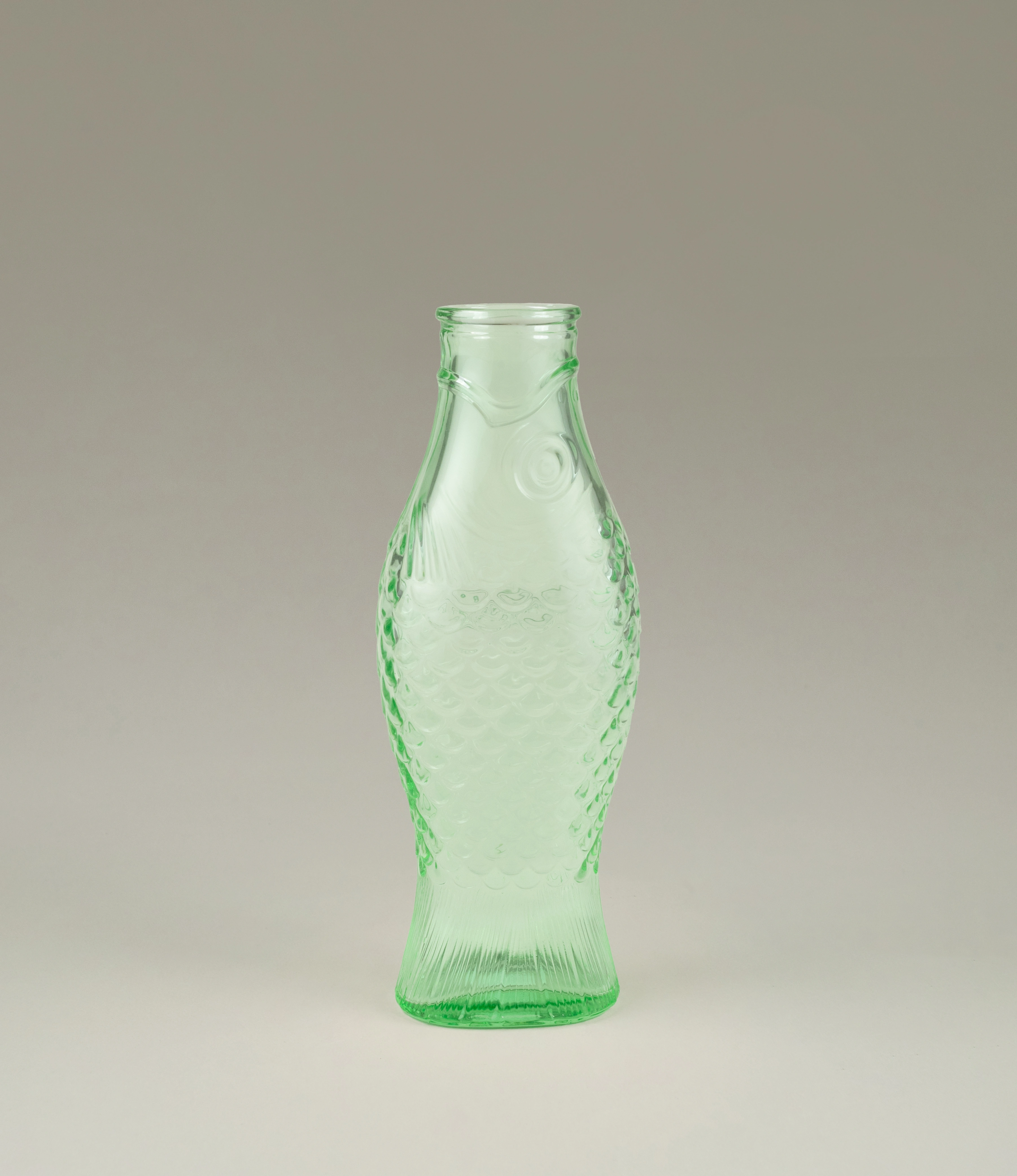 Carafe Green Fish is a decanter from Serax. The green glass has a shape of a fish.