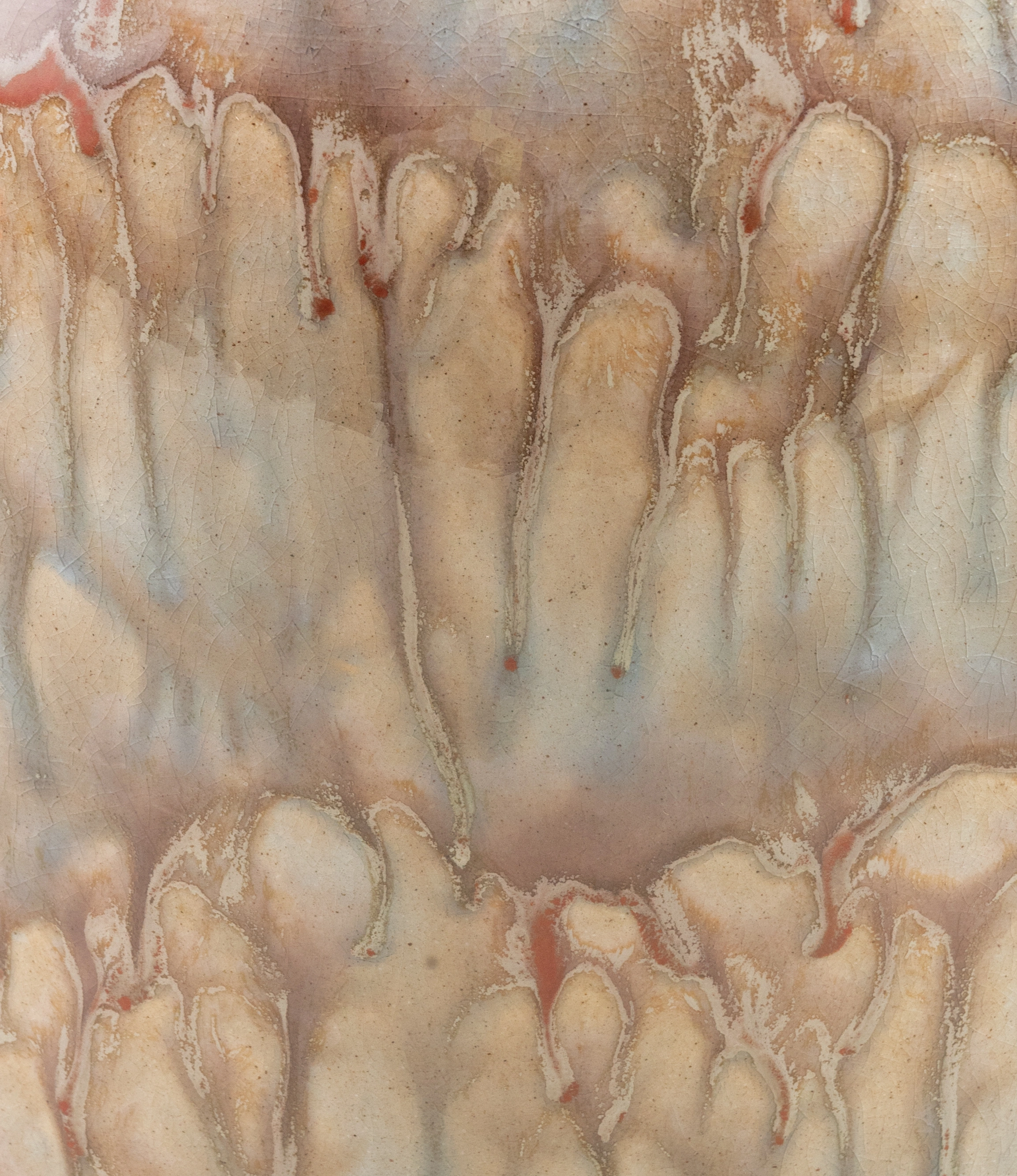 Mistique Planter from Serax is a rather large plant pot. Due to the glazing the item has a dripping pattern all over it in a light beige hue. The enchanting pattern is unique to each pot because of the its handmade characteristic. This is a detail photo of the glazing