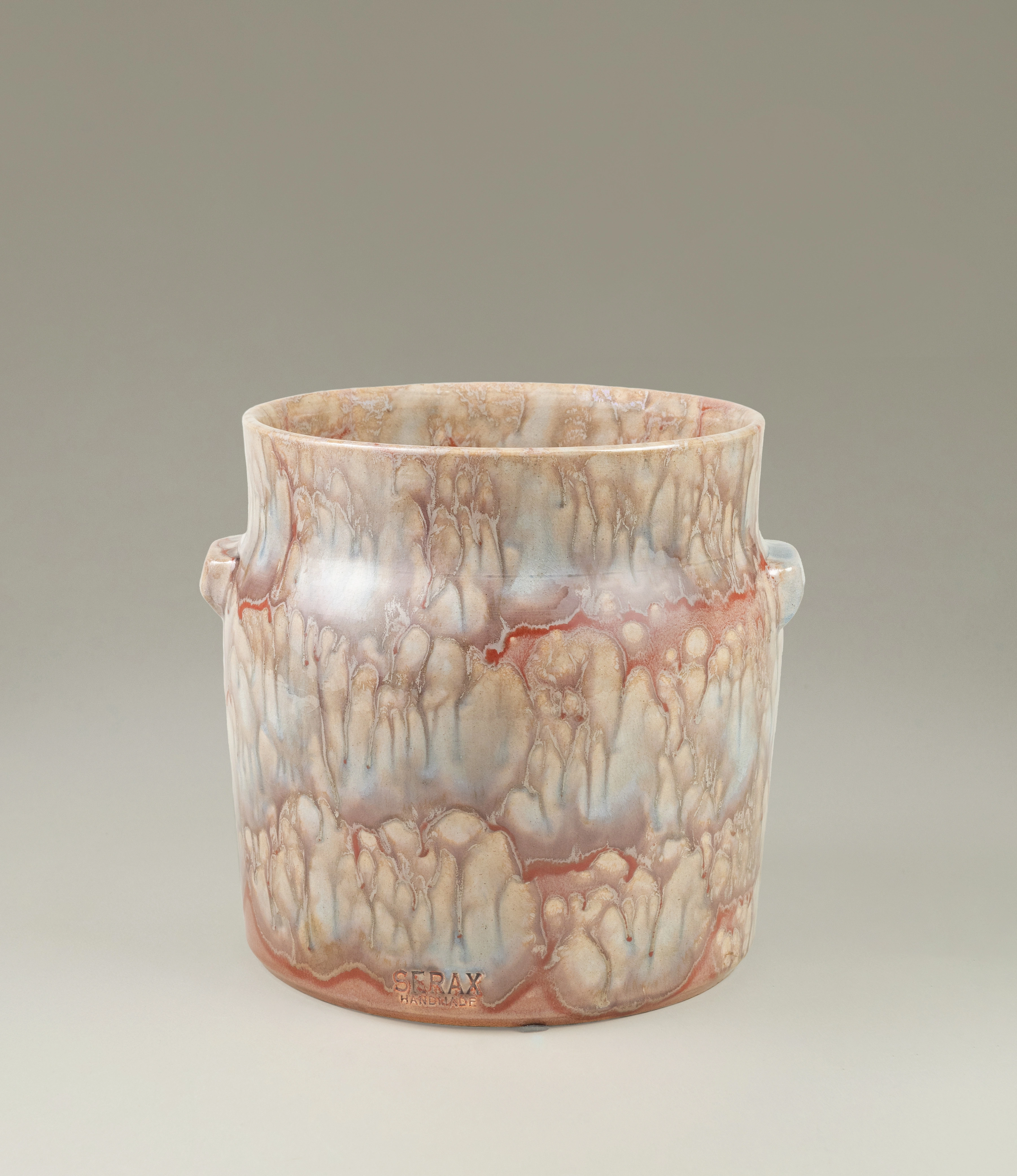 Serax Mystique Beige Flower Pot in a medium size, featuring an organic textured glaze with earthy beige and red tones. A stunning handmade piece that adds warmth and character to any space.