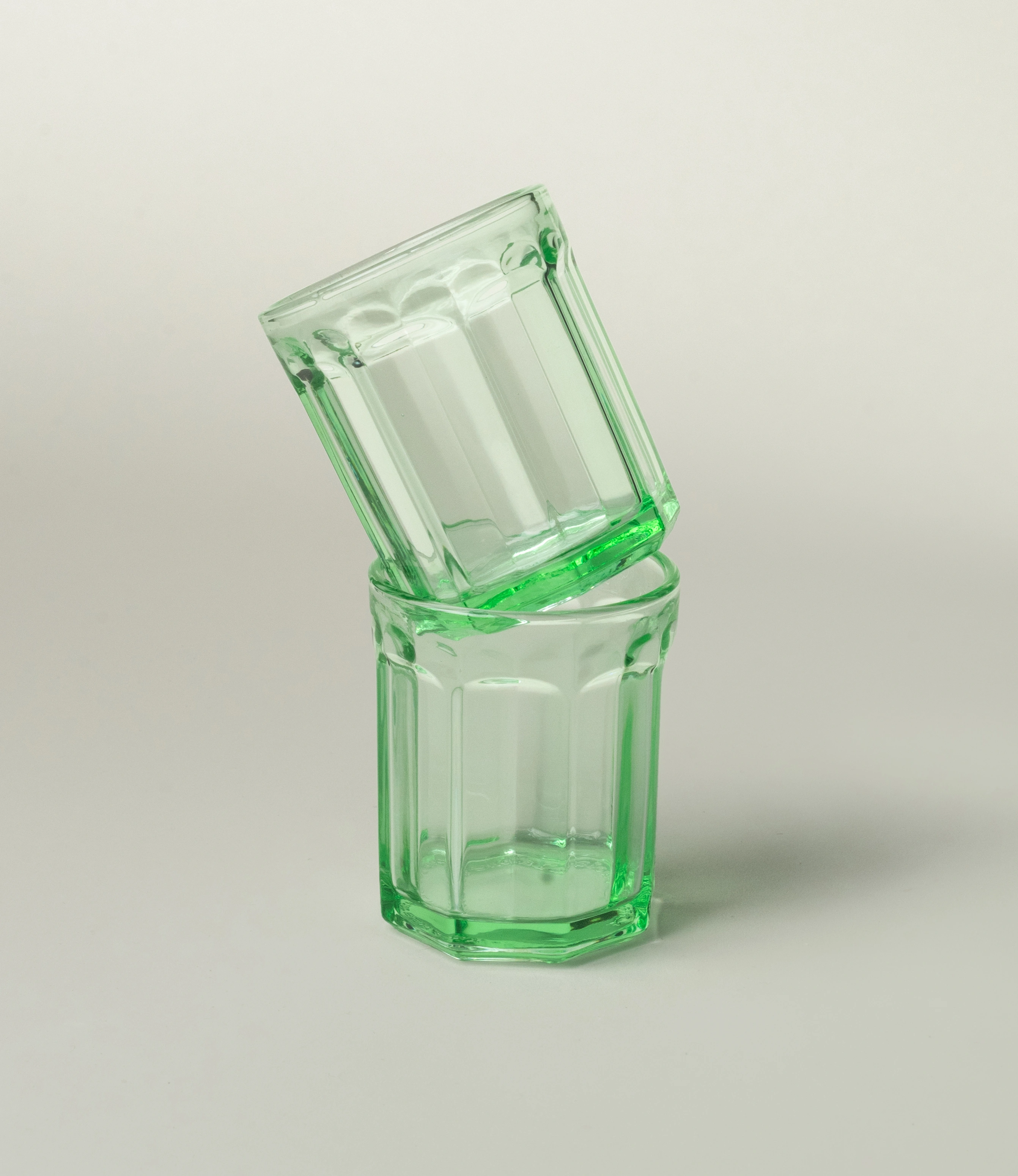 Serax Green Glass Tumbler, showcasing a design with vintage-inspired facets and a vibrant green tone. A versatile and stylish addition to elevate everyday dining.