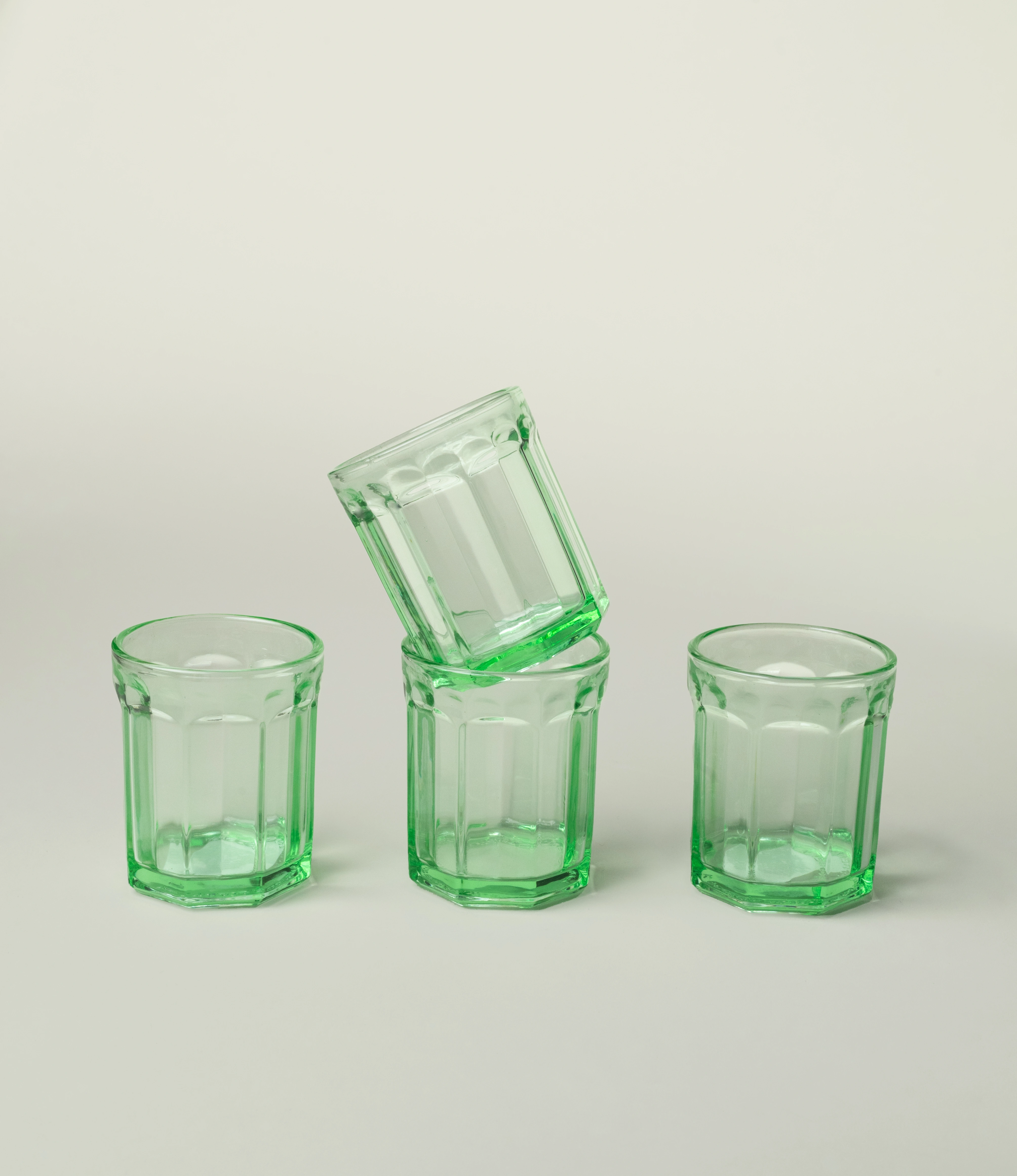 Serax Green Glass Tumbler, showcasing a design with vintage-inspired facets and a vibrant green tone. A versatile and stylish addition to elevate everyday dining.