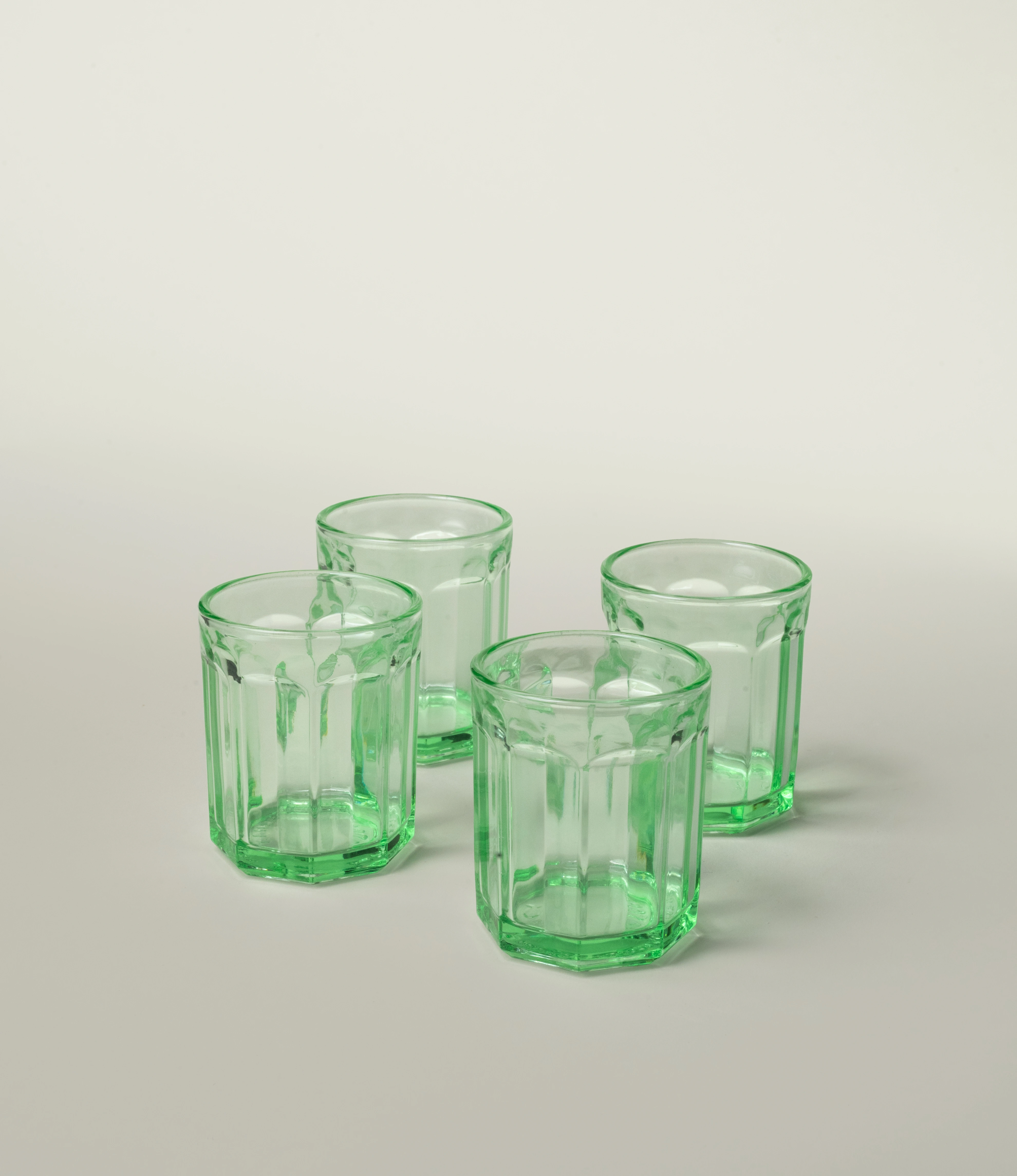 Serax Green Glass Tumbler, showcasing a design with vintage-inspired facets and a vibrant green tone. A versatile and stylish addition to elevate everyday dining.