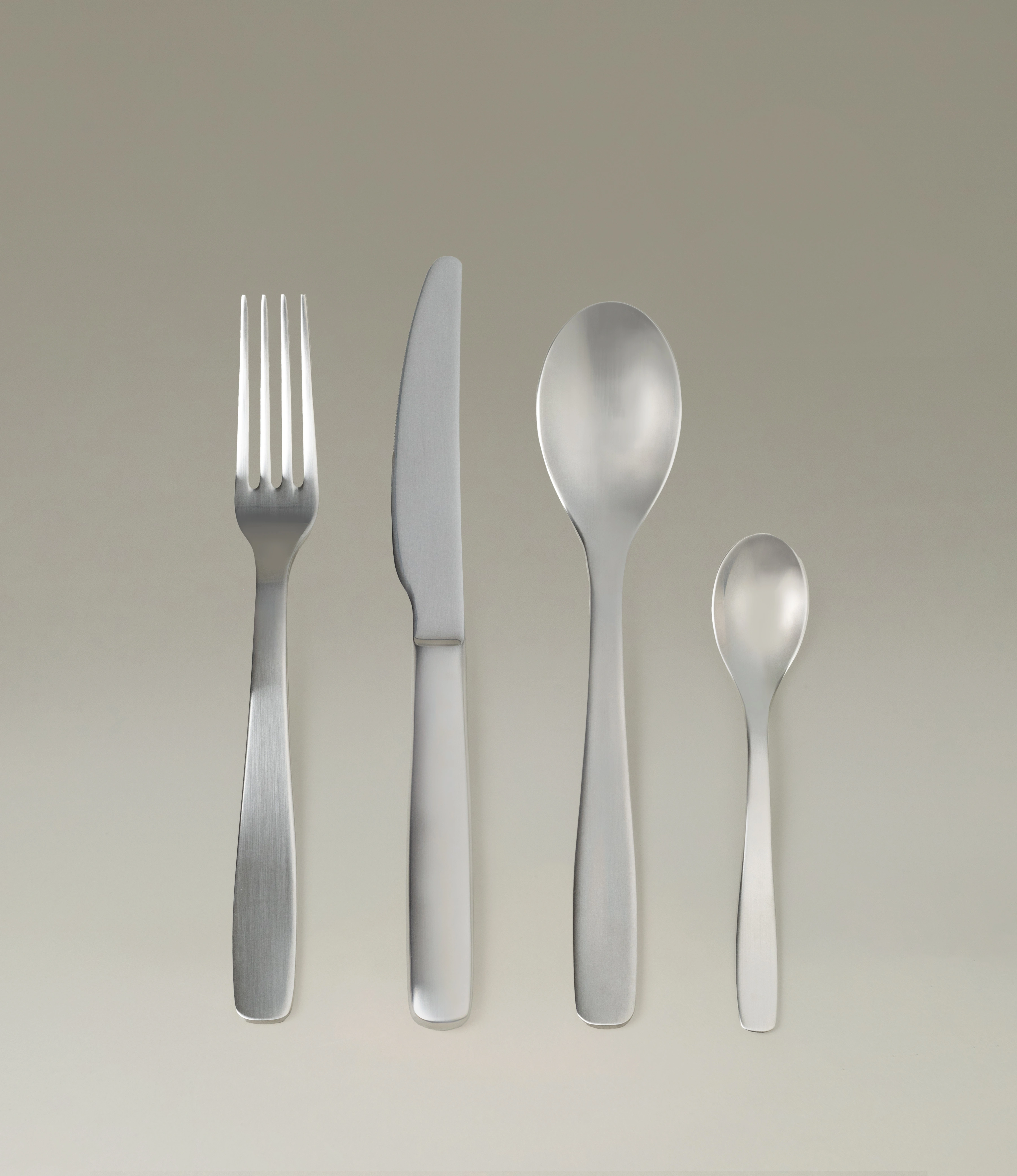 Serax Passe-Partout Cutlery Set, featuring a brushed stainless steel finish with elegant curves and a timeless design. Includes a fork, knife, spoon, and teaspoon for a sophisticated dining experience. The Set consists of 24 pieces in total.