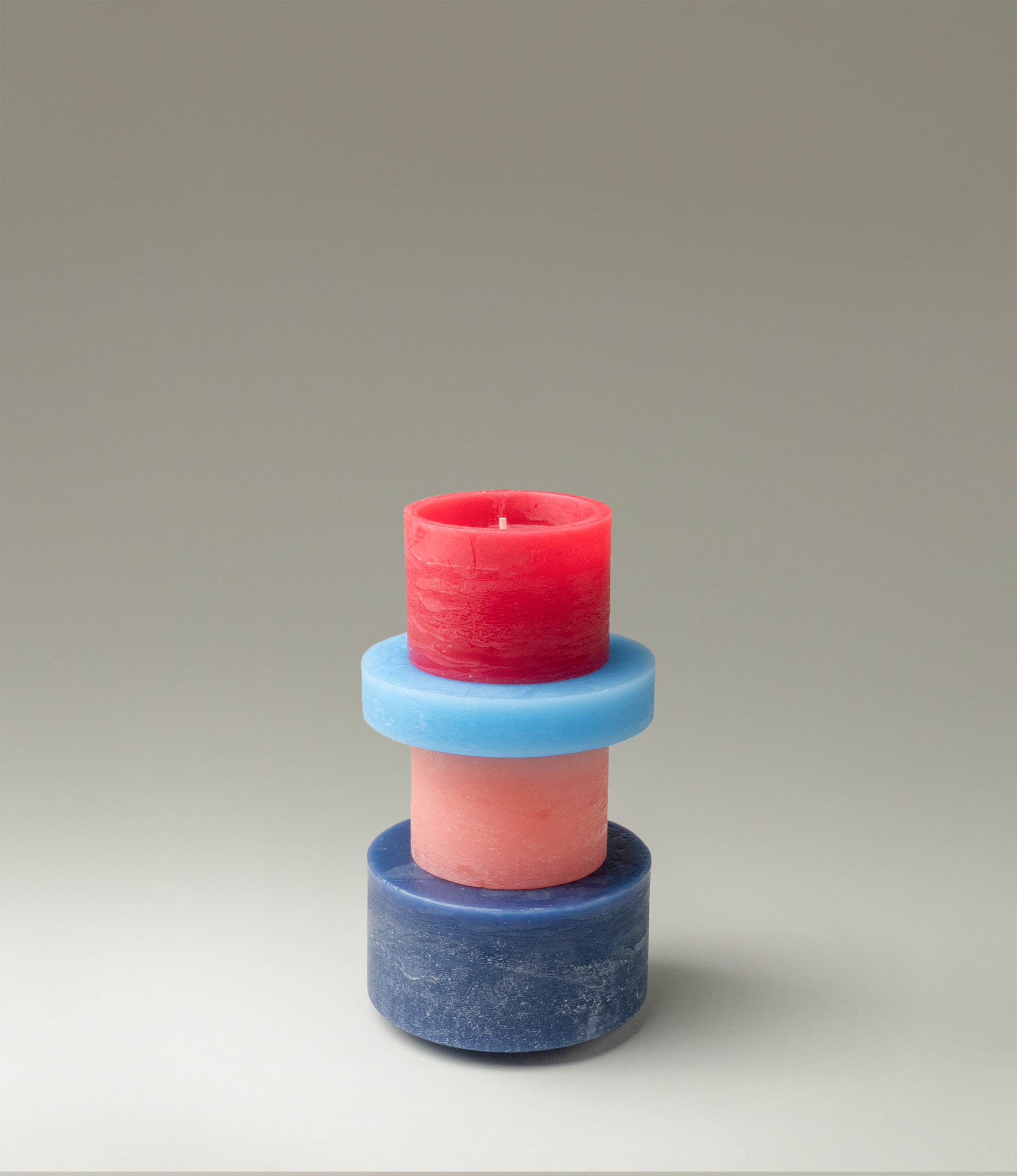 Candl Stack from Stan Editons is a playful item, you can rearrange the parts of the item as you wish. The parts are colored red, rose and blue.