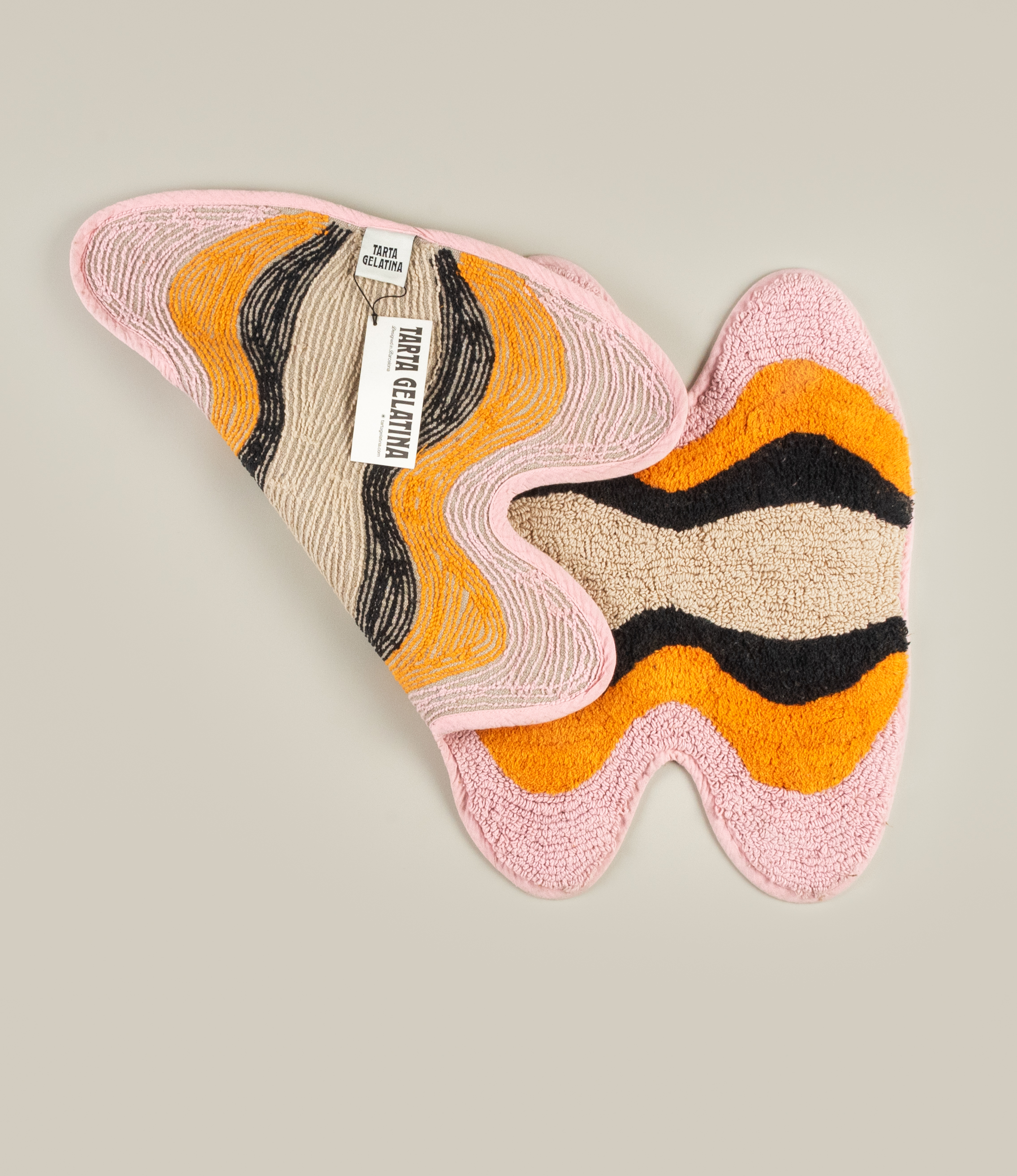 Reverse side of the Plankton Bathmat, showcasing its durable woven backing and Tarta Gelatina brand label.