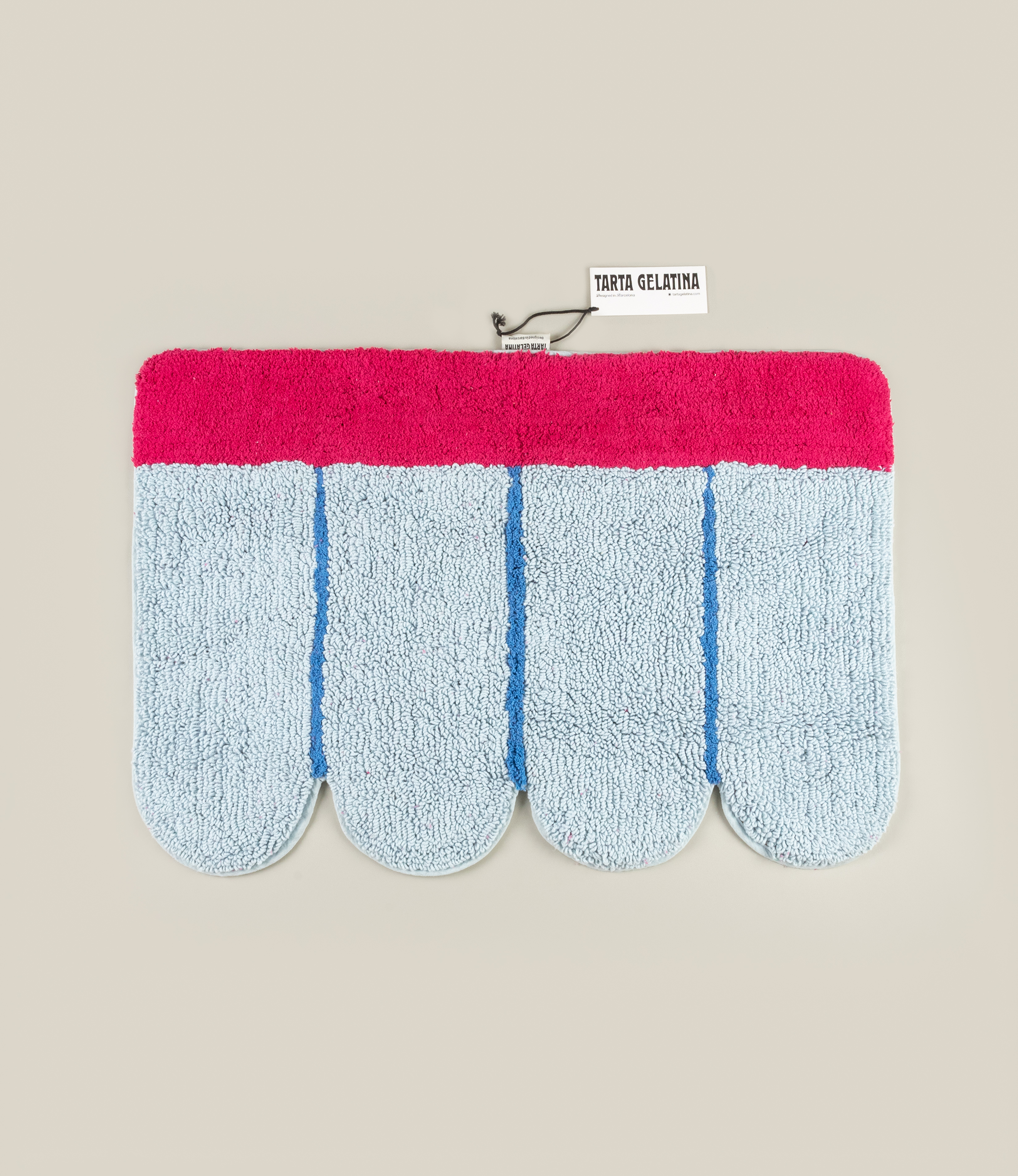 Full view of the Poolside Bathmat by Tarta Gelatina laid flat, showcasing its intricate tufted texture and retro-inspired design.
