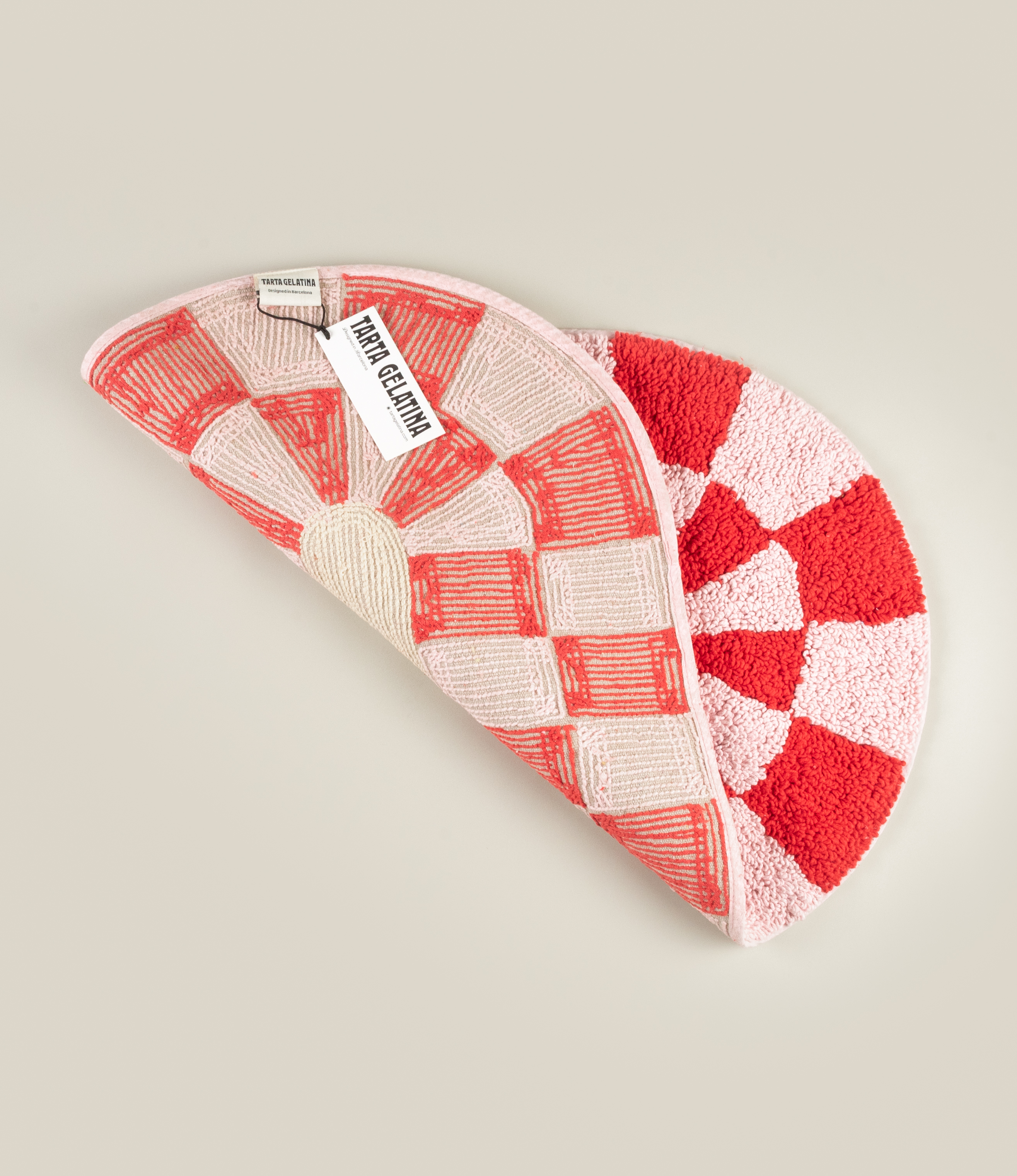 Reverse side of Tarta Gelatina's Miranda Bathmat, showcasing a woven cotton backing with the Tarta Gelatina brand label for authenticity and durability.