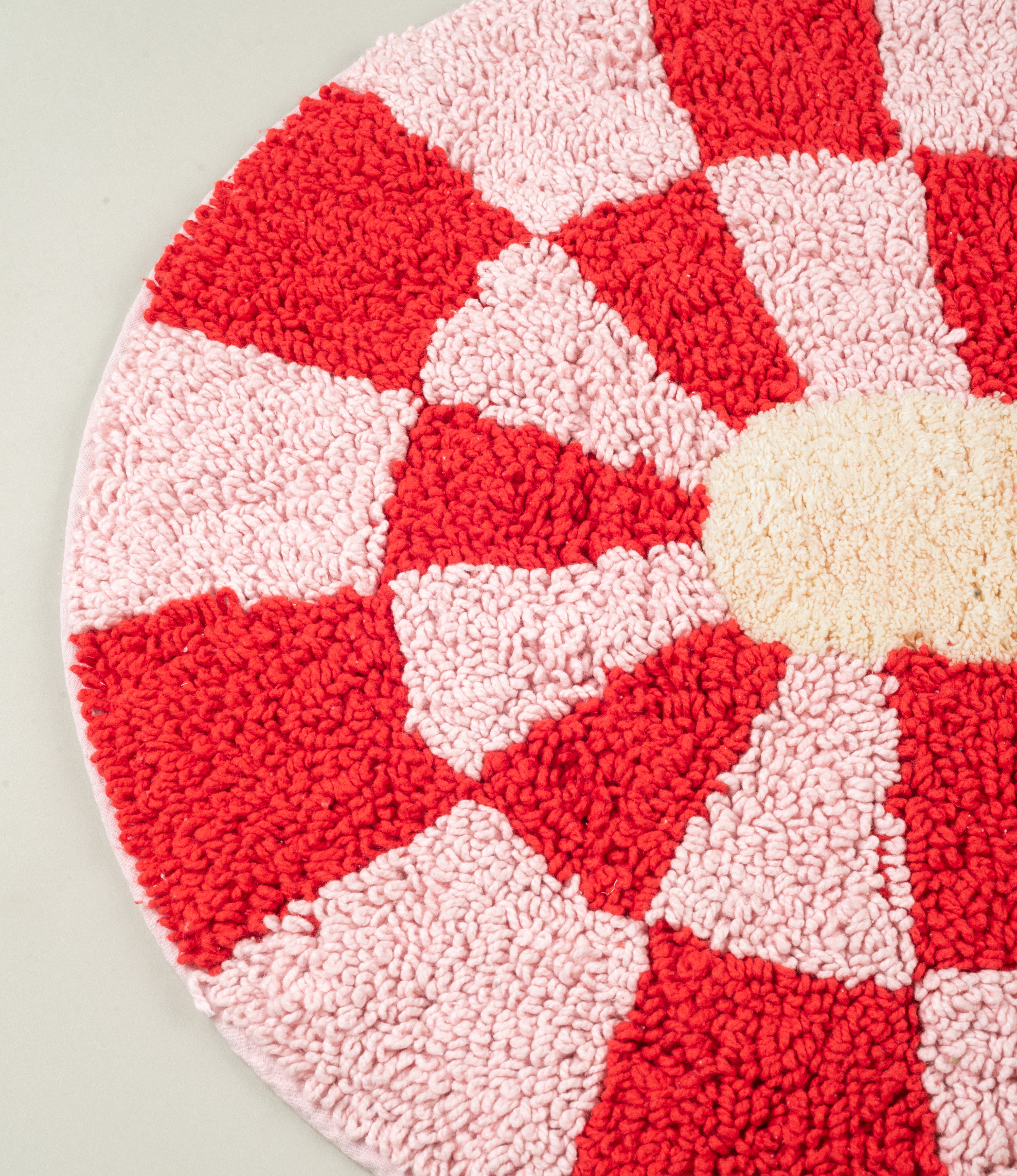 Detailed view of the Miranda Bathmat’s plush cotton texture, highlighting its high-quality absorbent material and geometric pattern.