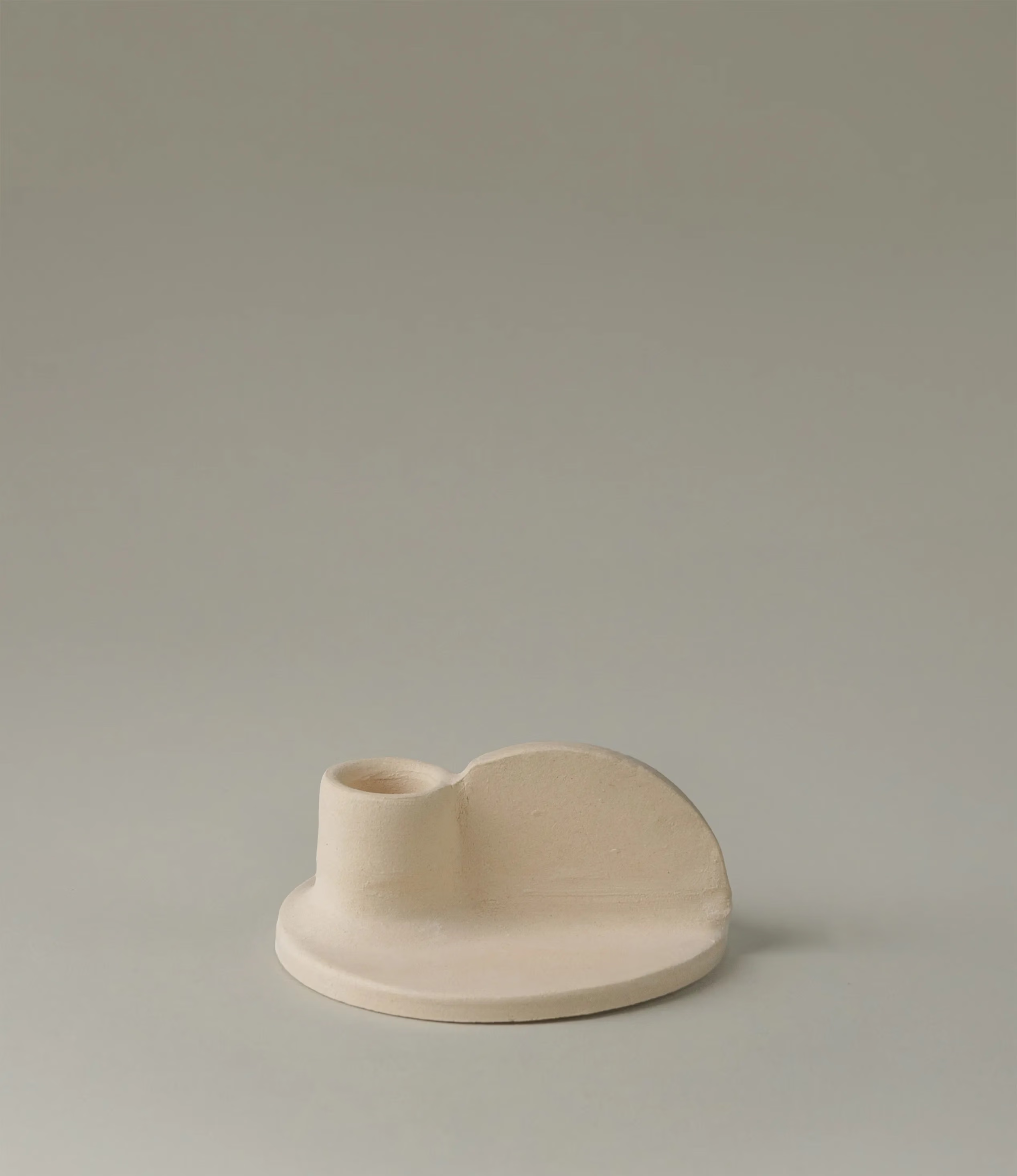 Myrtha Candle Holder is created by Alfareria La Nava. This small item comes in a cream color and it has a natural matte finishing.