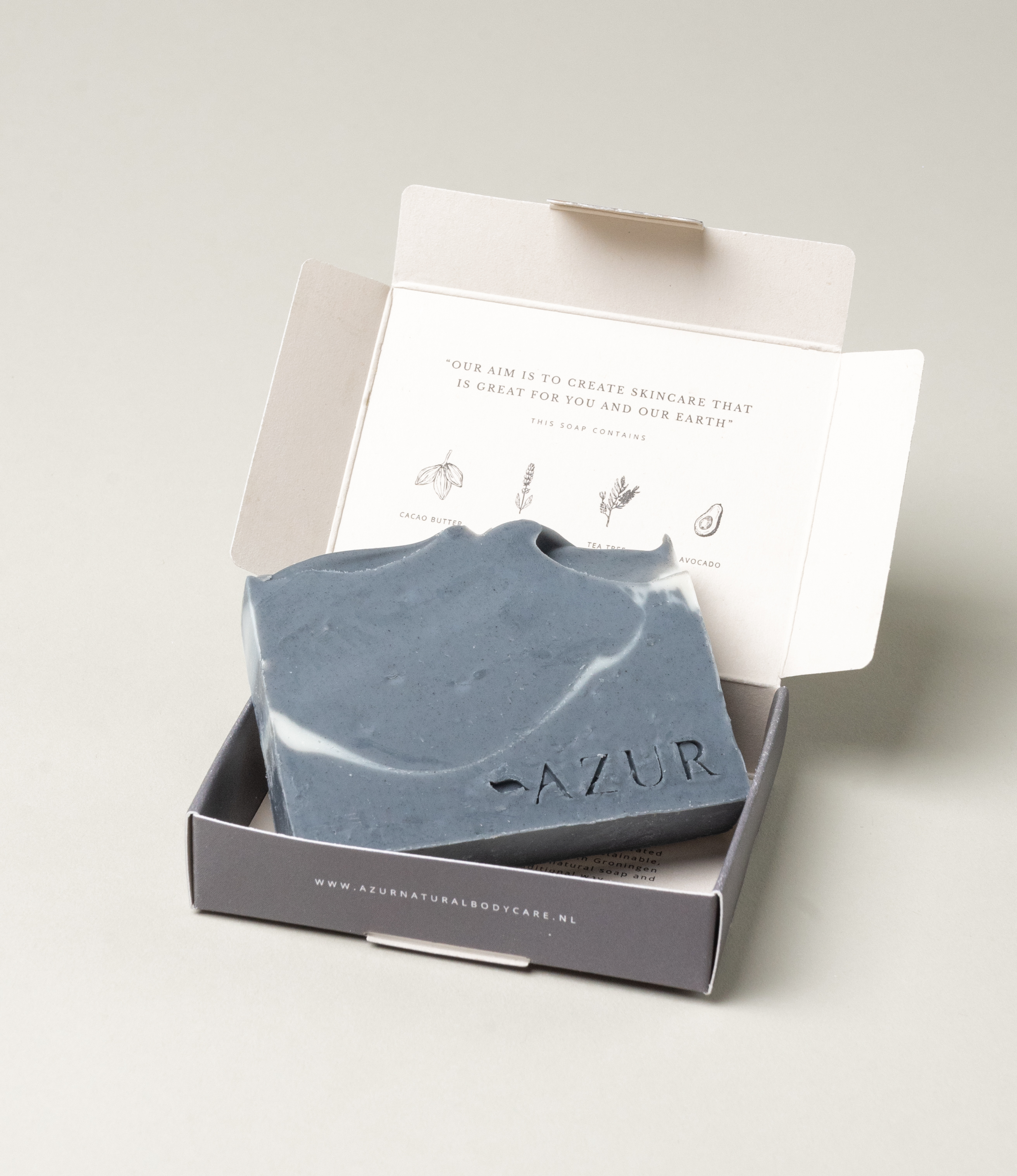 Black Cleanser from Azur is a natural, plastic-free alternative for deep-cleansing. The charcoal and tea tree oil soap has a dark color with a light line inside. 