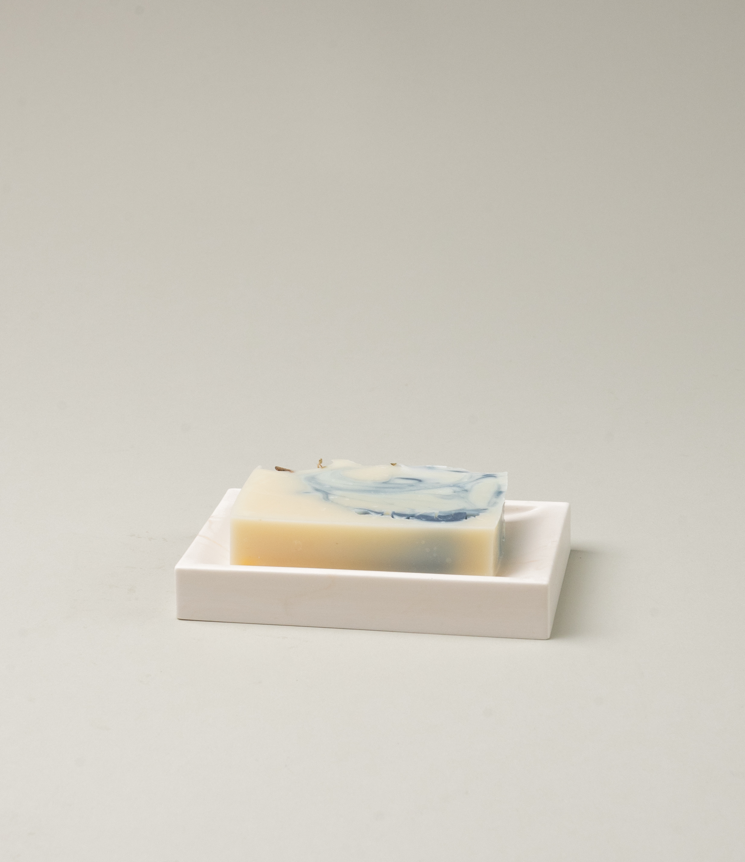 Marble Soap dish from Azur Natural BodyCare. The dish has a subtle rose marble effect on an ivory base. The dish is a great addition to any of our soaps.