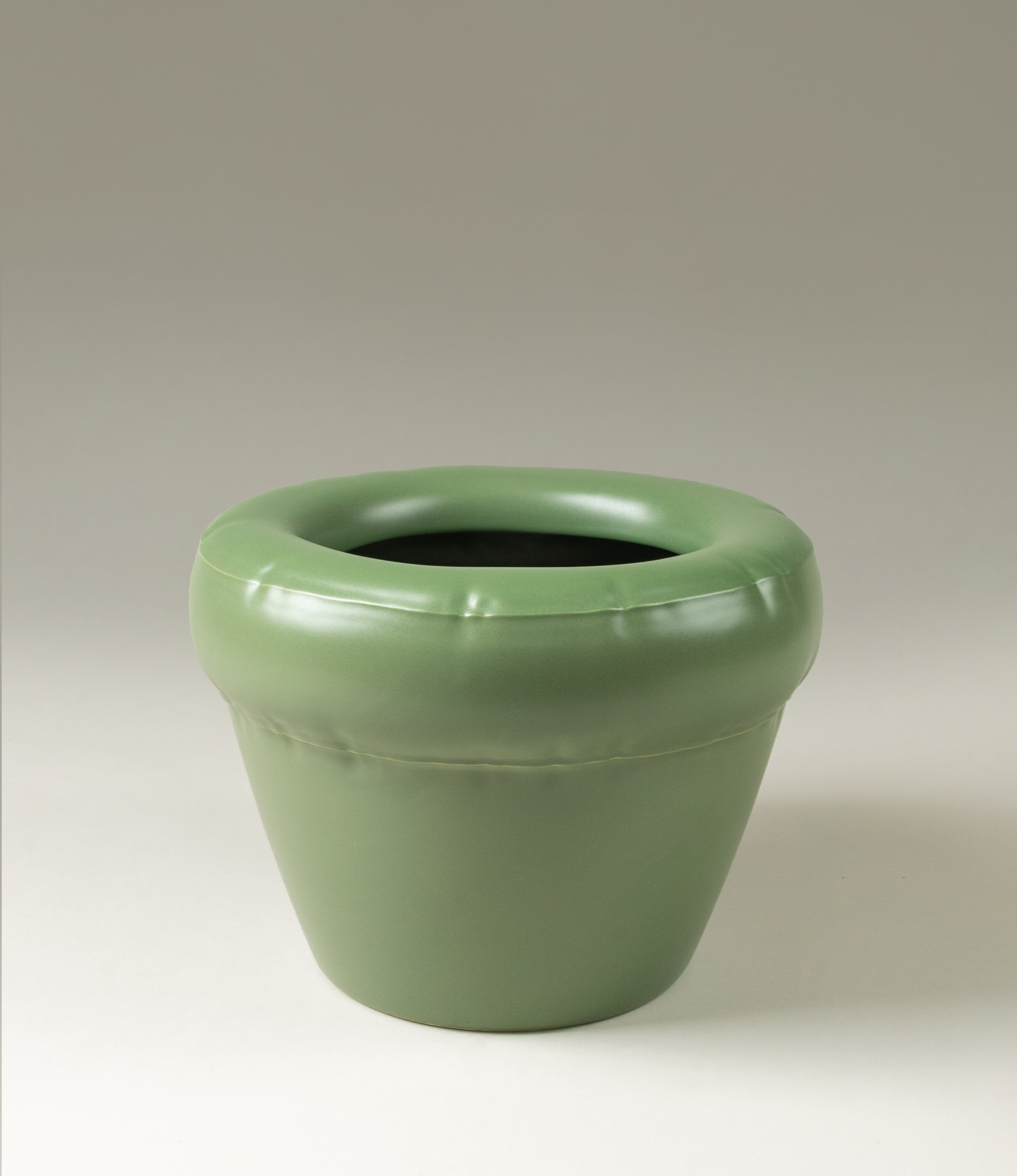 Homestudyo planter pierre in moss color. The planter design looks like and inflatable ballon although it is made of ceramics