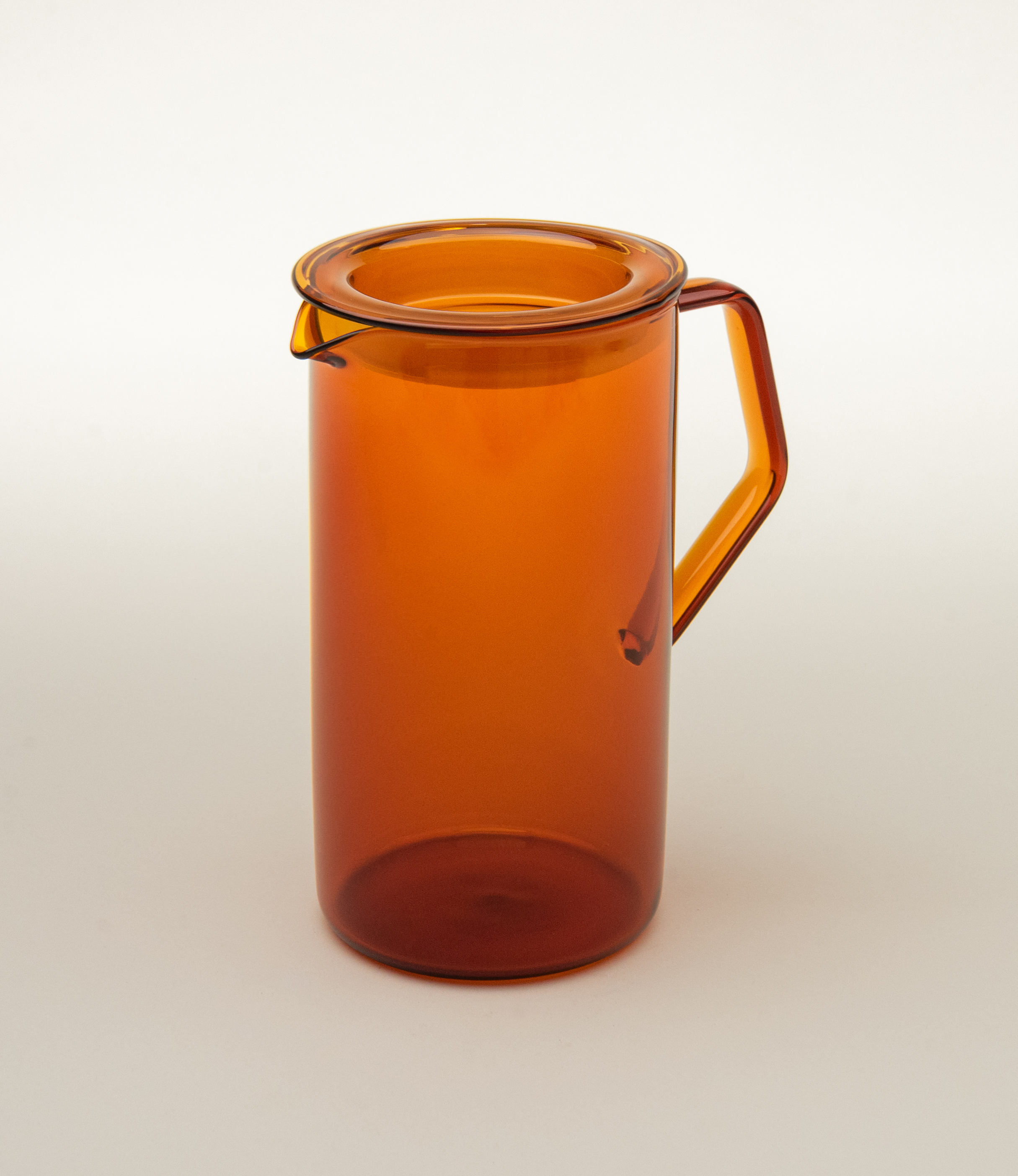 Cast Amber Jug from Kinto. The Item can hold 750ml of liquid. The modern geometric shape is a perfect companion to any kitchen.