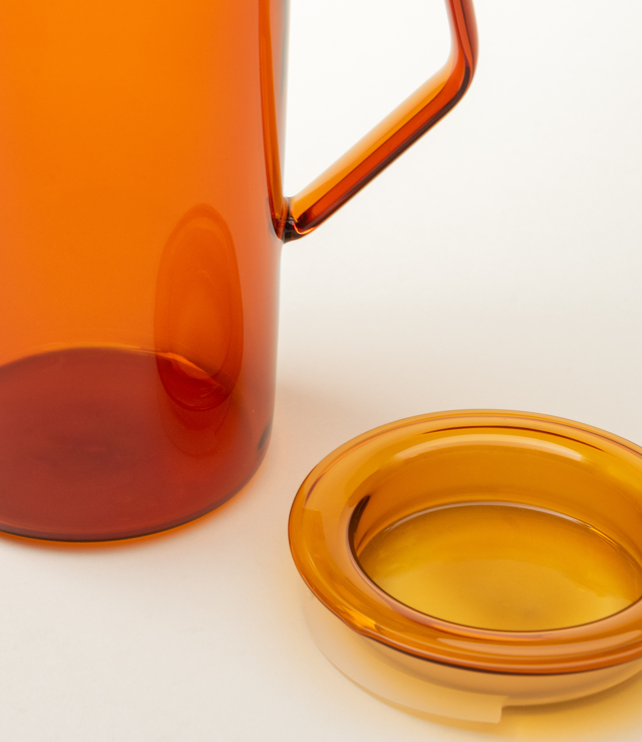 Cast Amber Jug from Kinto. The Item can hold 750ml of liquid. The modern geometric shape is a perfect companion to any kitchen.