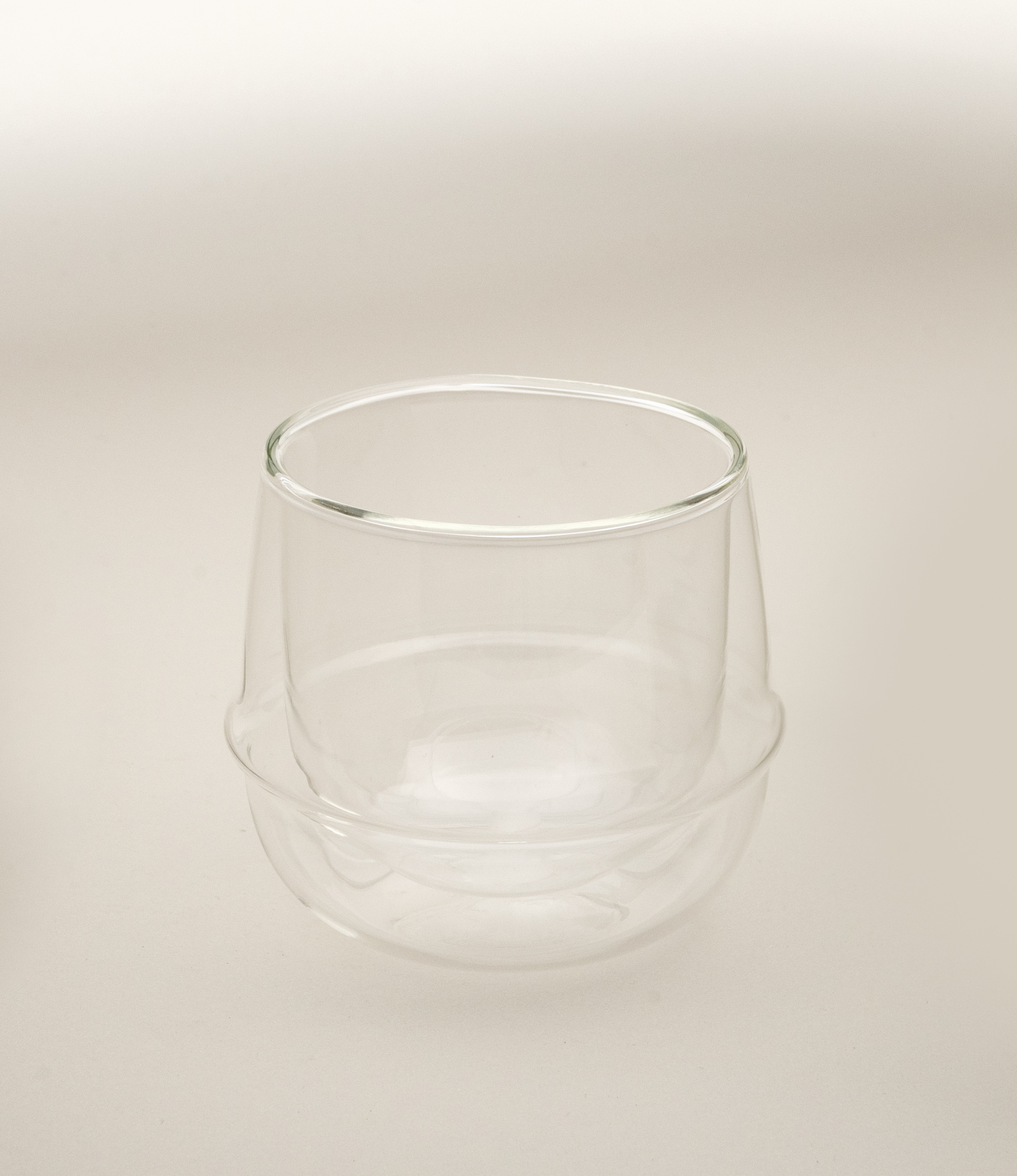 Kronos Wine Glass from the Japanese brand called Kinto. The glass is double walled and perfectly clear. The glass can hold 250ml of liquid.