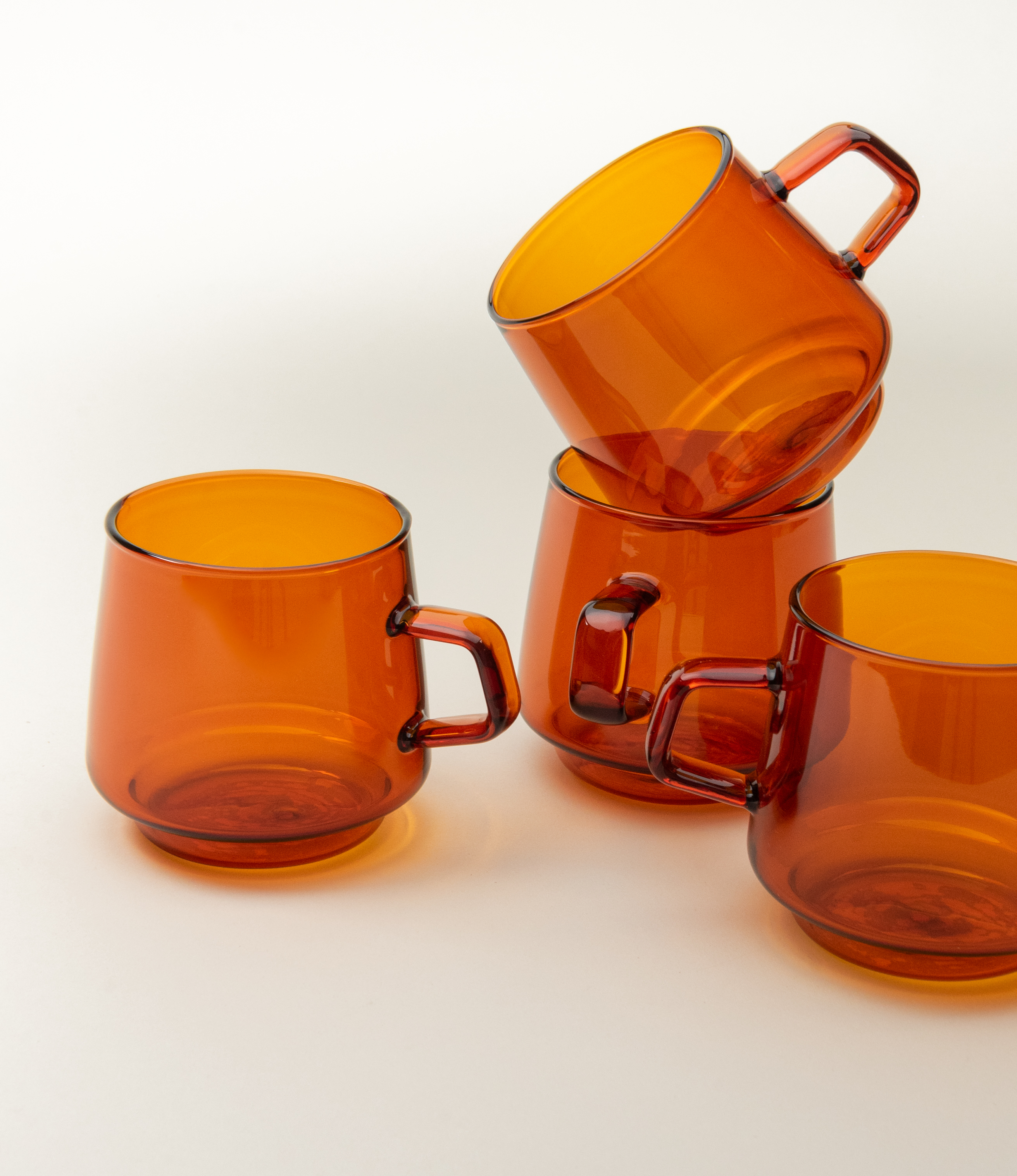 Kinto's Sepia mug comes in a set of 4. Its nostalgic shape works perfectly well with amber color and glass material.