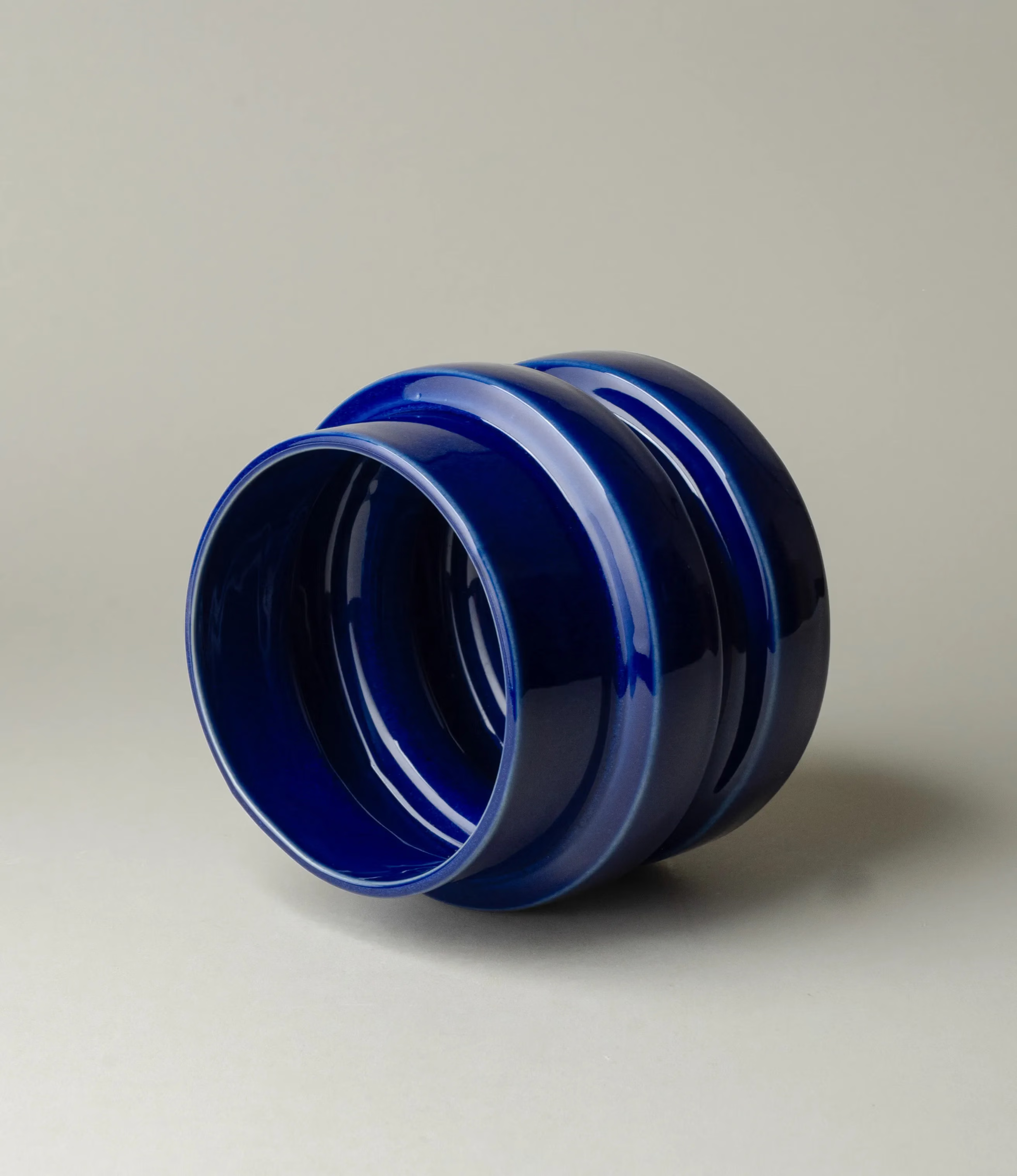 NW Buoy was designed by Nova Casa Atlantica. The planter has a dark blue color with a glossy glaze. 