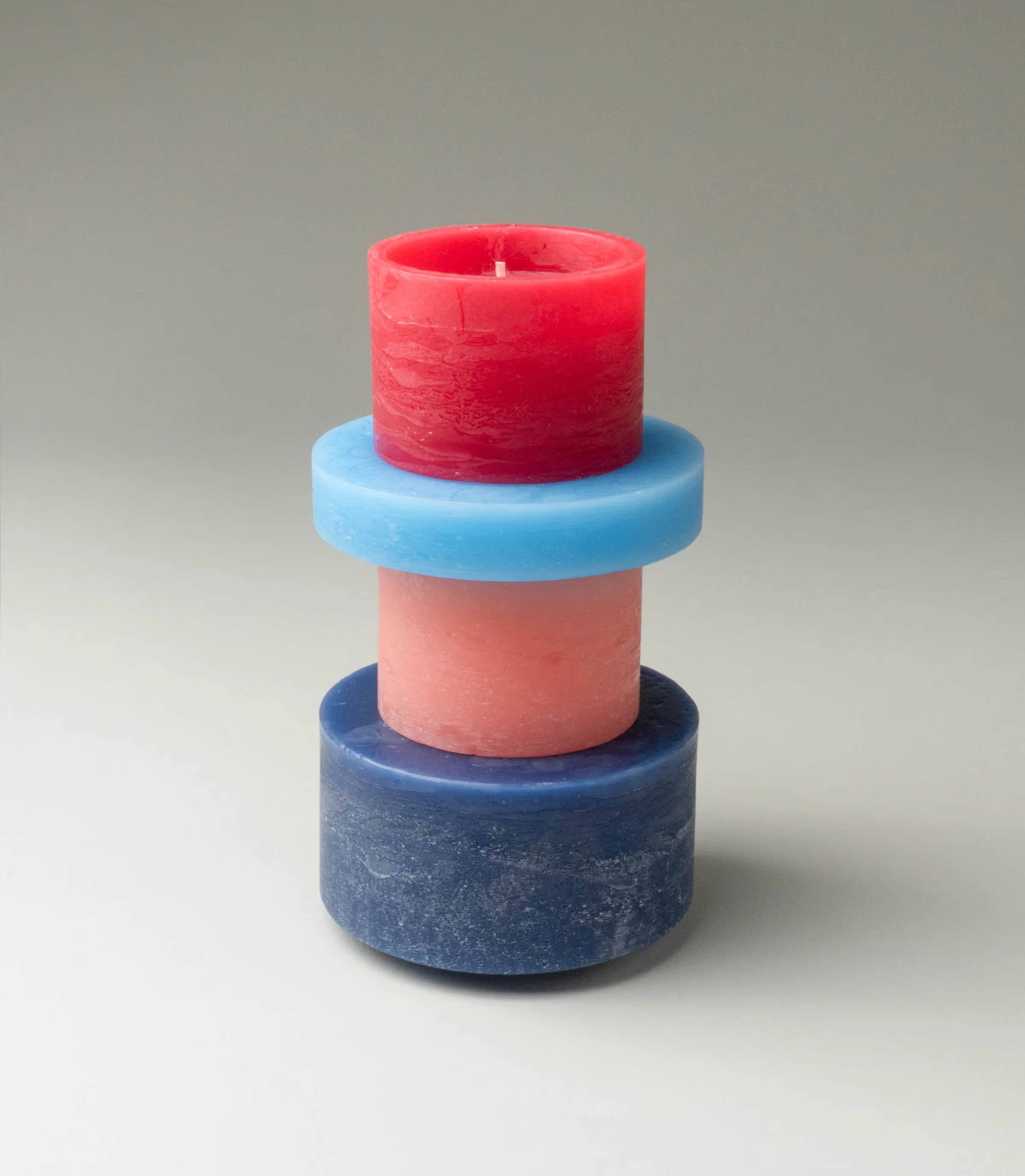 Candl Stack from Stan Editons is a playful item, you can rearrange the parts of the item as you wish. The parts are colored red, rose and blue.