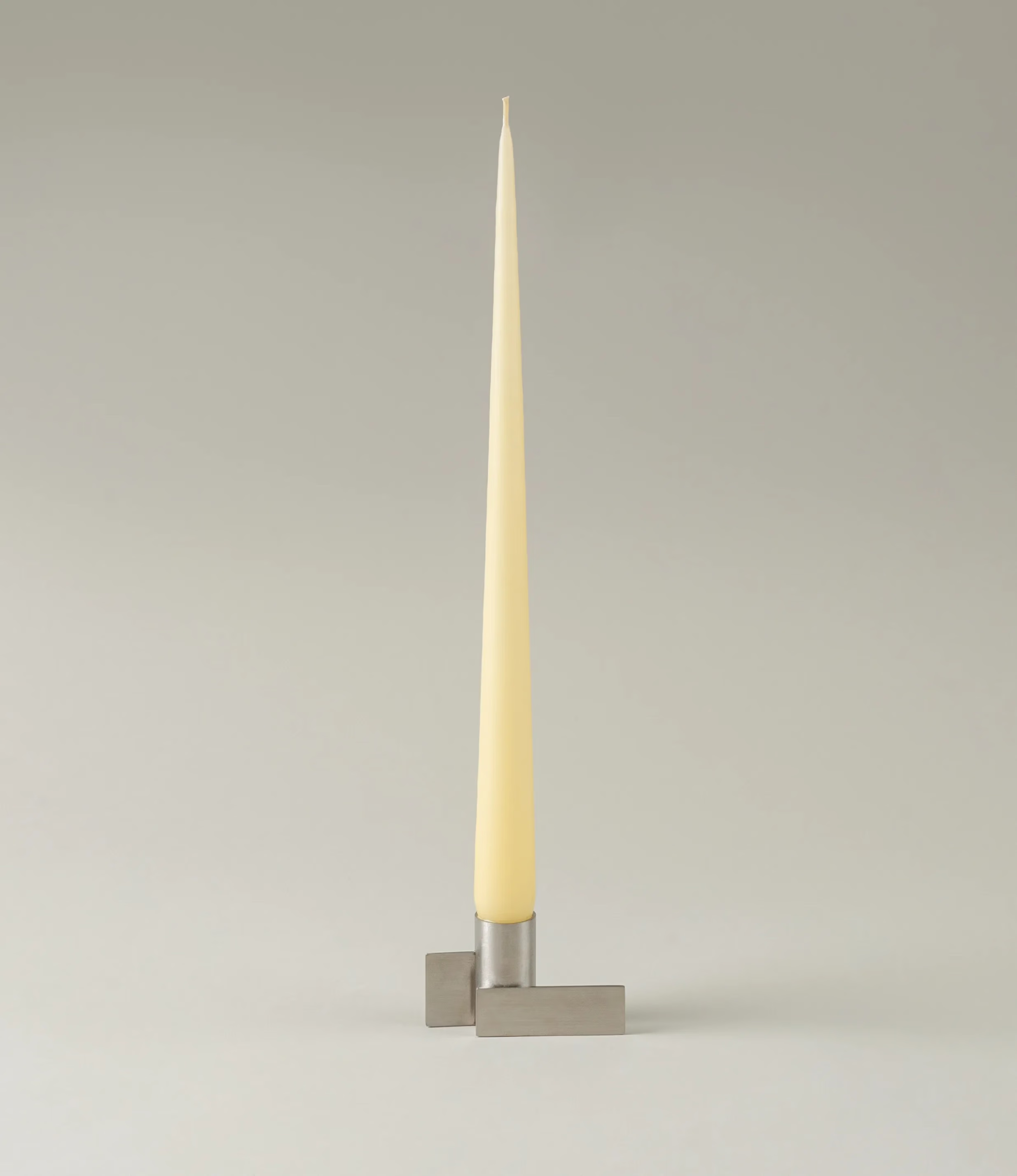 Icon Iysestage 01 from Stences is a candleholder made for taper candles. This picture shows the chrome variant of this item. The steel material has a brushed surface which emphasize the soft geometric shapes of the product in question.